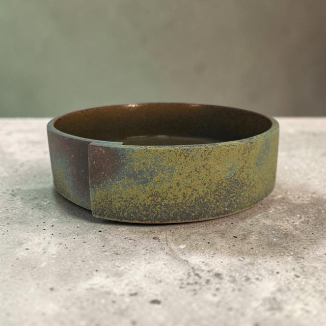 A substantial late twentieth-century Japanese ceramic suiban for ikebana, formed in heavy stoneware and finished with a...