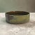 A substantial late twentieth-century Japanese ceramic suiban for ikebana, formed in heavy stoneware and finished with a...