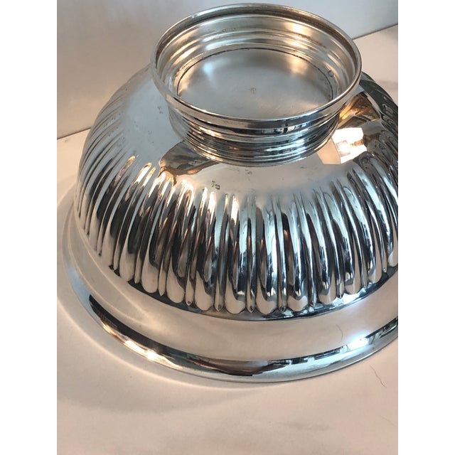 Elevate your decor with this fabulous 1940s Fluted Silverplate Bowl. Whether you use it to hold an orchid or wrapped...