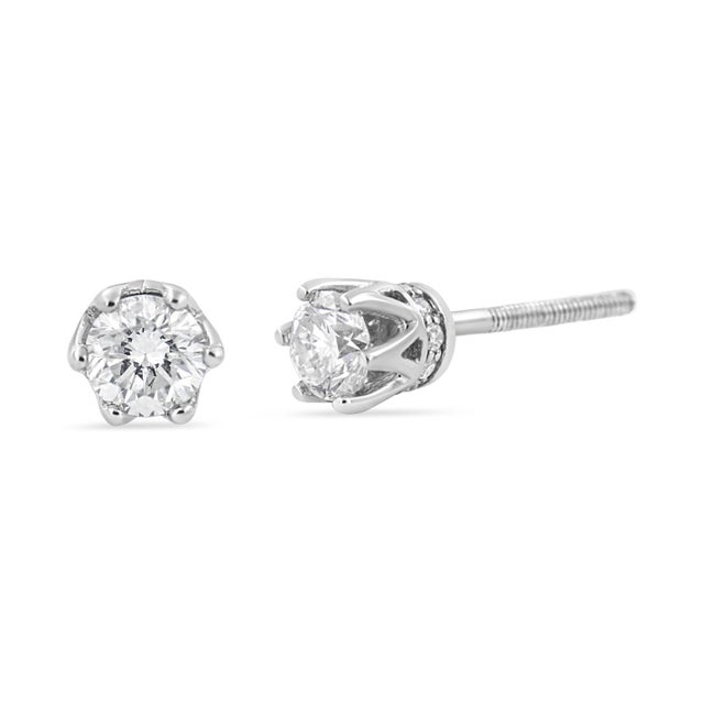 With regal hidden details, these diamond stud earrings are anything but ordinary. From the front, these 14kt white gold...