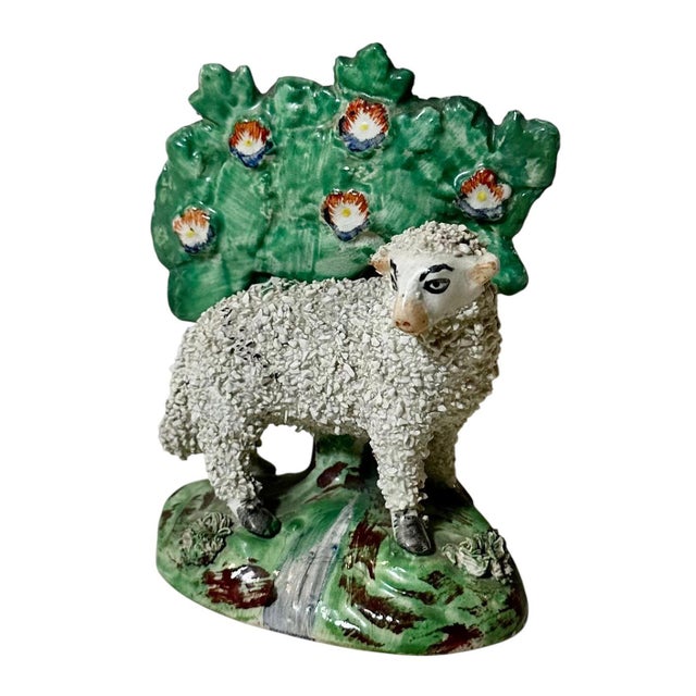 A 19th century antique English Staffordshire pastoral figurine. Ewe with confetti bocage.