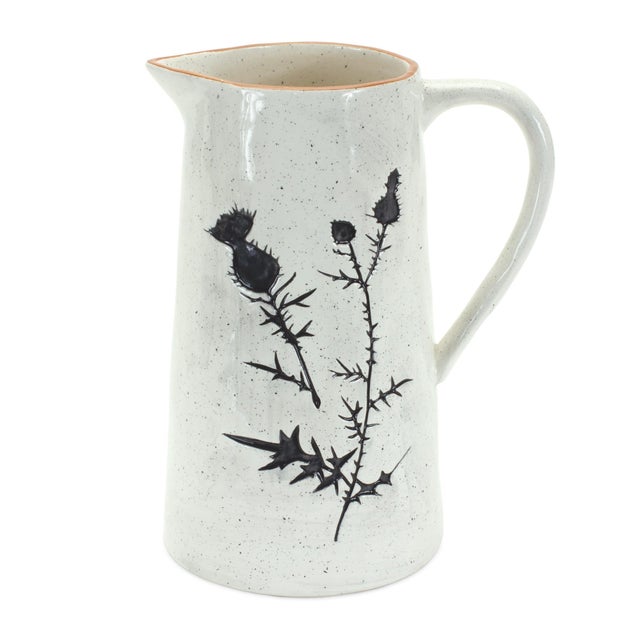 Bring timeless charm and elegance to your home with this set of Rustic Thistle Etched Pitcher Vases. Featuring a classic...