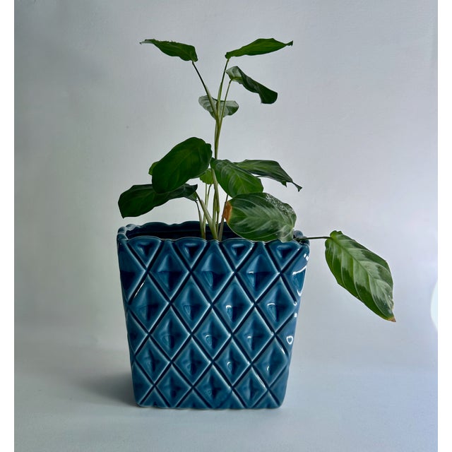Mid Century Modern Geometric Quilted Pattern Ridged Rim Glazed Blue Ceramic Flower Pot. Featuring an upright rectangular...