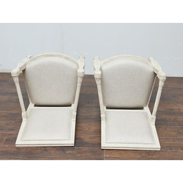 These French armchairs from circa 1920 embody the refined elegance of the Louis XVI style with their neoclassical...