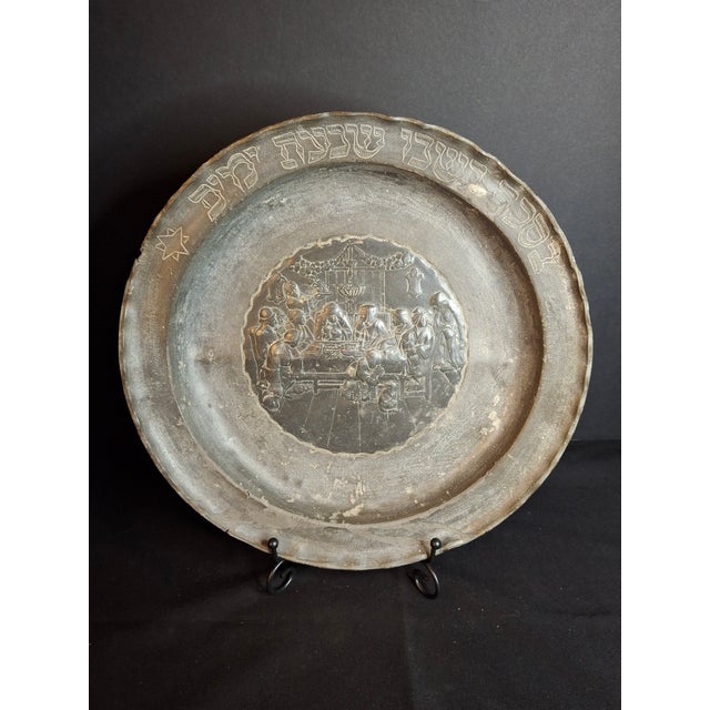 An exceptional 18th-century Continental pewter festival charger featuring an applied high-relief central medallion showing...