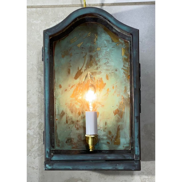 Single vintage wall lantern, hand crafted from solid brass with one 60/watt light , Suitable for wet location. This...