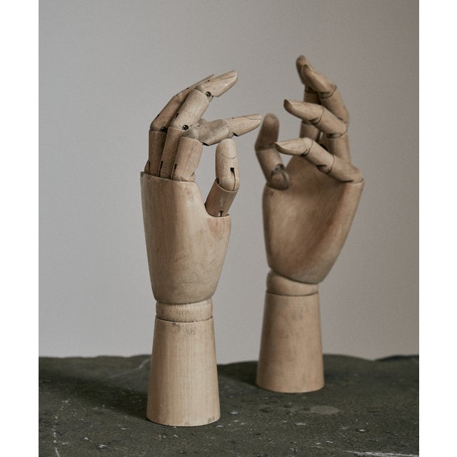 Vintage articulated wooden hands. These hands are handcrafted and were used as artists models or for retail store...