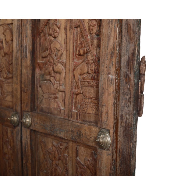 Antique Indian Carved Teakwood and Brass "Folk Art" Door, c. 1880, the 4 panels on each door (it opens in the middle)with...