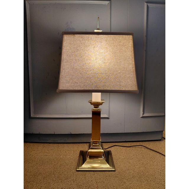 A timeless vintage Stiffel table lamp crafted in solid polished brass with the brand's signature neoclassical styling....