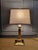 A timeless vintage Stiffel table lamp crafted in solid polished brass with the brand's signature neoclassical styling....