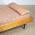 A stunning and versatile Mid-Century Modern daybed, dating to the 1950s. This piece is a masterclass in the "form follows...