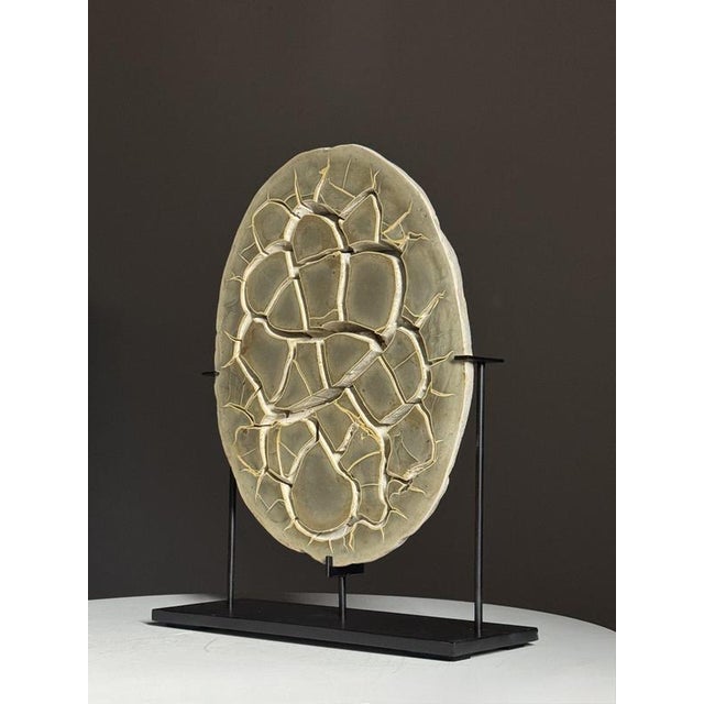 Beautiful septaria nodule cross-section on a metal stand. Septaria nodules are fossilized mud bubbles and are about 50 to...