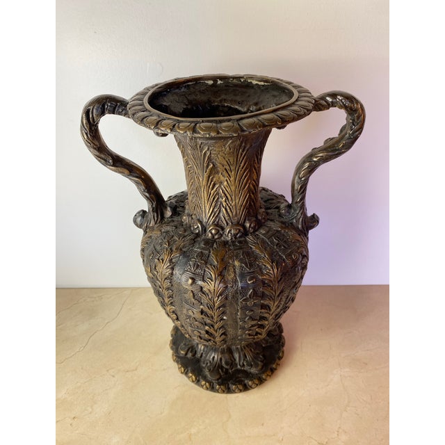 Substantial decorative urn in a Renaissance/Baroque Revival style, cast in bronze or brass with a rich, deeply oxidized...