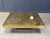 Exceptional etched brass coffee table with a beautiful inlaid agate stone and a black lacquer and brass base. This hand...