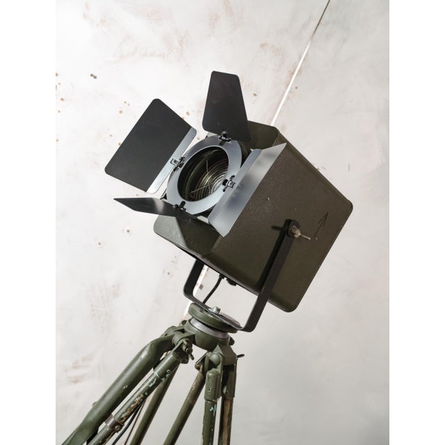 A green-patinated Strand Electric Patt 45, one of the most recognized names in British stage lighting, standing on a...