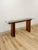 This vintage Danish console table showcases a distinctive puzzle construction, a hallmark of Danish mid-century design...