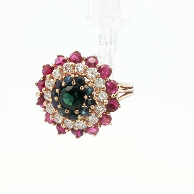 This beautiful cluster ring is made in 14k yellow gold with an exceptional combination of natural sapphire, ruby and...