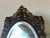 Gorgeous Vintage solid brass table top vanity mirror. The piece features a very ornate floral design with beveled oval...
