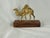 Late 20th Century Moroccan Brass Camel on Wooden Display Stand This figure with beautiful patina and fine details is a...