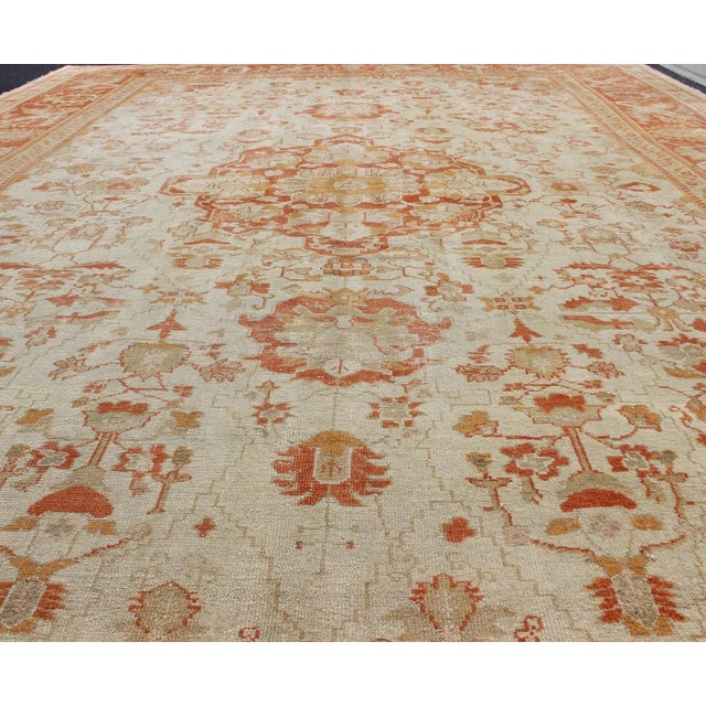 Antique Turkish Floral Oushak Rug in Cream, Rust Red, Orange and Green For Sale - Image 4 of 12