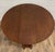 This is a rare and gorgeous antique tiger oak drop leaf gateleg round occasional table, side table, or center table....