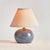 This sweet little blue glazed ceramic lamp is at home in any coastal setting. The texturedCream shade and petite base make...