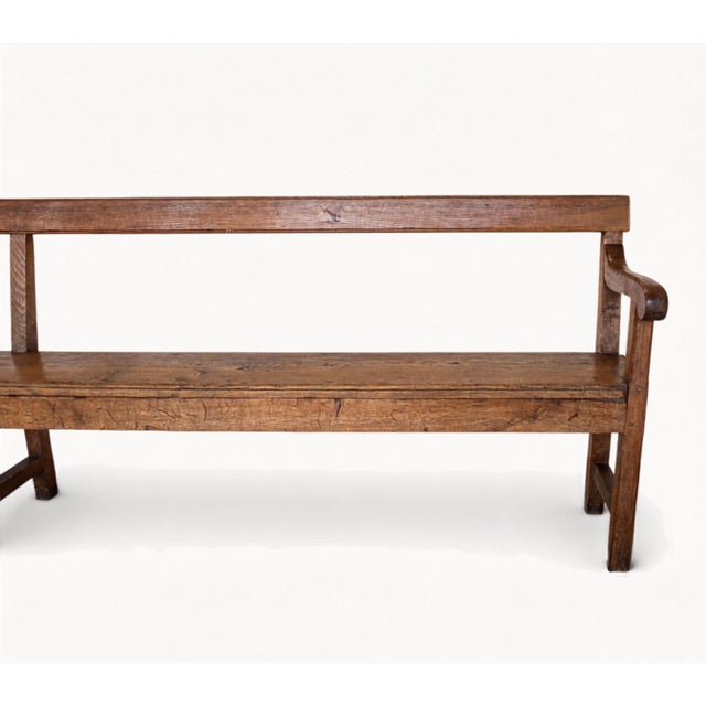 Impressive 19th century French provincial oak bench with an exceptionally long 117-inch profile and beautifully aged...