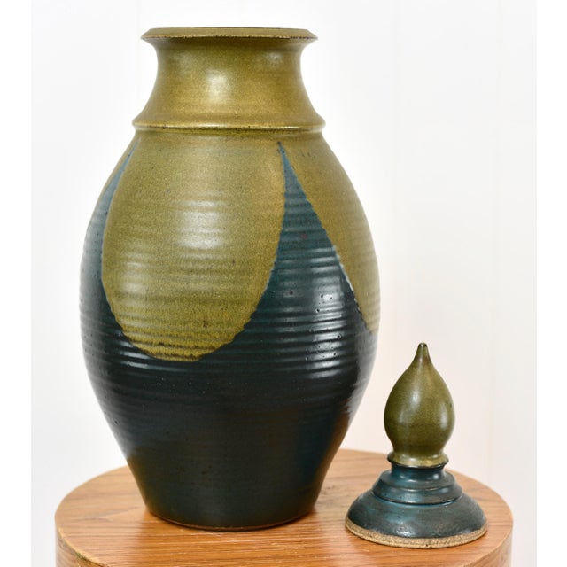 Incredible large covered jar, signed on bottom and dated 1974. Measurements: Height (with lid): 18" Width: approximately...