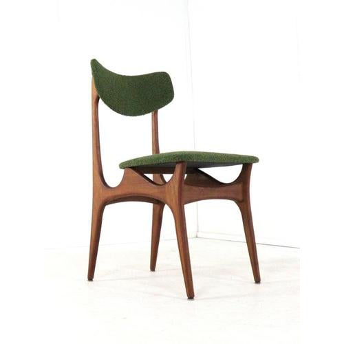 This distinctive set of vintage chairs is a prime example of accessible mid-century modern design, where form, function,...