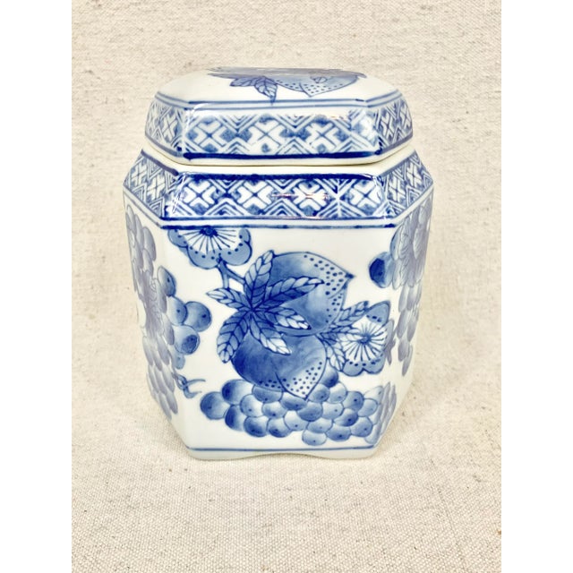 Lovely vintage chinoiserie lidded container. Blue and white floral design. Hexagonal shape. Perfect to display on a...