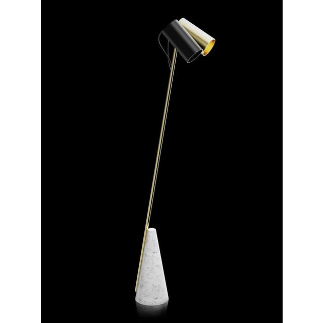 Floor lamp with Carrara white stone base, brushed brass structure and double lightshield made in black paint and brushed...