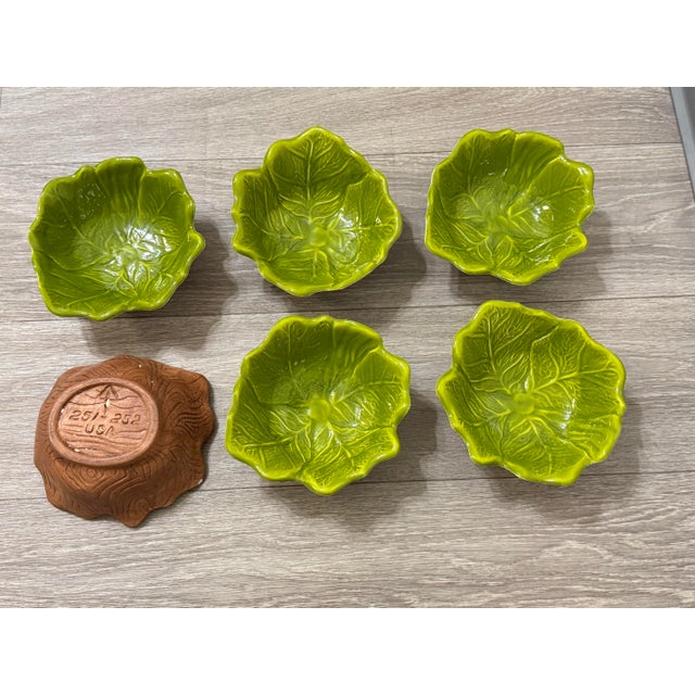 A lush, storybook set of six mid-century ceramic bowls by Sequoia Ware, each molded in a cabbage leaf motif with rich...