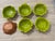 A lush, storybook set of six mid-century ceramic bowls by Sequoia Ware, each molded in a cabbage leaf motif with rich...