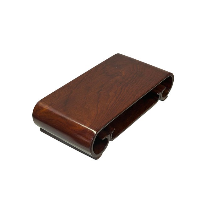 This exquisite brown rectangular display stand, featuring distinctive scroll legs, offers a touch of timeless elegance to...