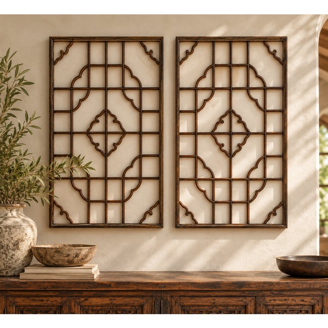 A set of two matching fretwork panels, built from fine wooden bars in a pattern of squares and rectangles, with a...