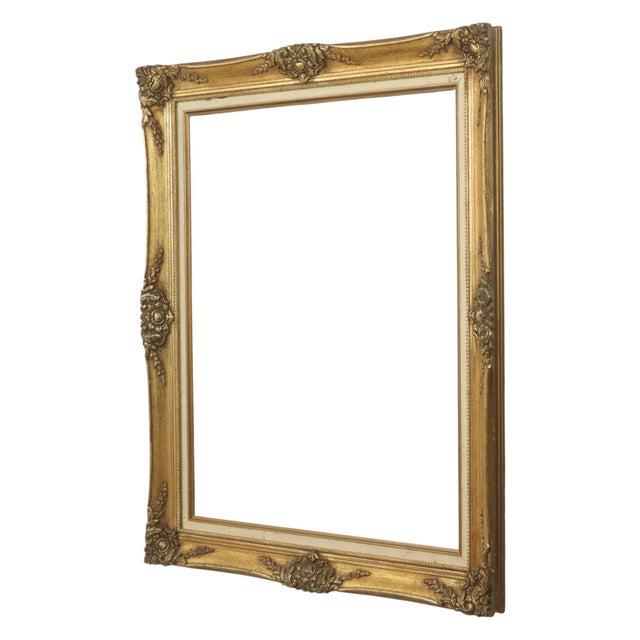 Large gilded vintage pine frame with a beautiful patina of age, entirely in the Baroque style, decorated with acanthus...
