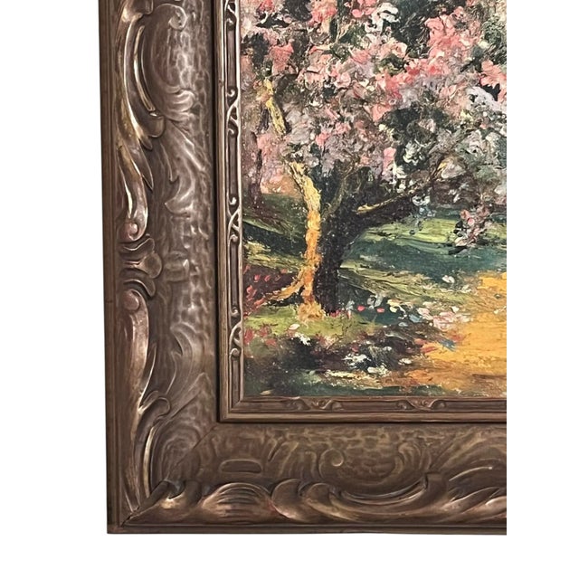 Add a touch of color to your decor with this early 1900s landscape painting depicting a cottage surrounded by blooming...