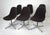 A set of six swiveling Eames Aluminum Group dining chairs with cast four star bases having plastic foot pads to protect...