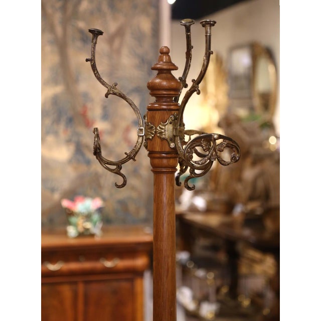 Bring elegant craftsmanship to an entryway, mudroom, or dressing room with this handsome antique hall tree. Crafted in...