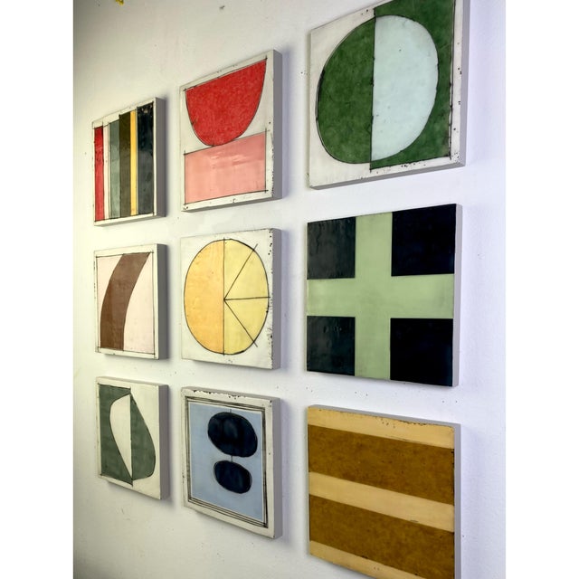 Nine 8x8 cradled wood panels make up this encaustic mixed media art piece. In the photo they are hanging spaced...