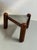 A rare and sculptural side table by Gruppo DAM, built on three robust solid mahogany posts arranged in a triangular base...