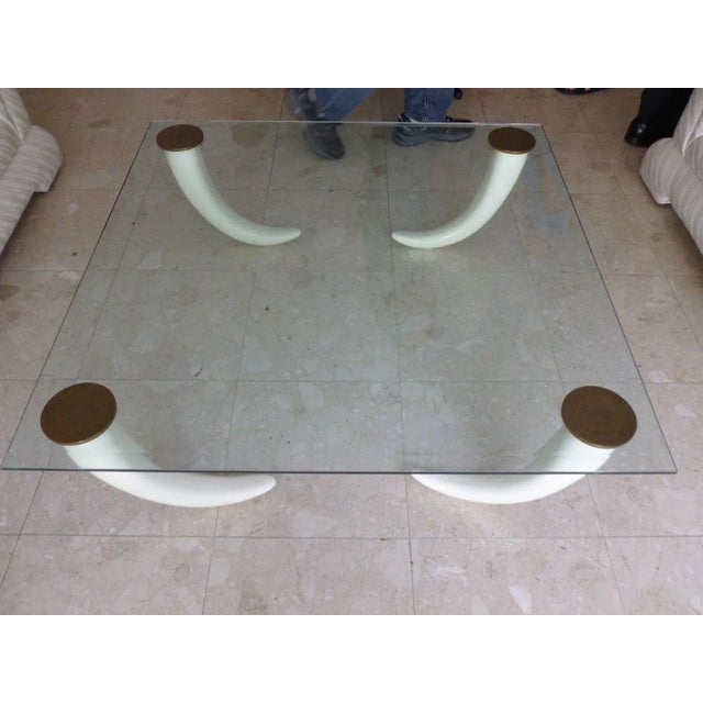 Smashingly Chic 1970's glass coffee table with faux tusk legs and brass caps - p sold as found in good vintage condition...