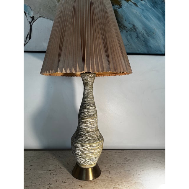 Large midcentury handmade ceramic lamp with brass base and etched detailing in the style of Bitossi. Gorgeous matte finish...