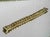 Vintage 1960s Italian bracelet by UnoAErre, crafted in 18k solid yellow gold. Wide braided Milanese-style mesh...