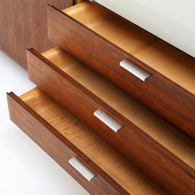 A beautiful 1950s cabinet by Pastoe, designed by Cees Braakman, with the clean geometry and warm teak that makes mid-...