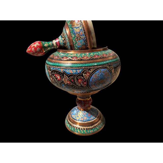 A vintage Turkish copper covered urn with a rounded pedestal form and tall finial lid, decorated entirely by hand....