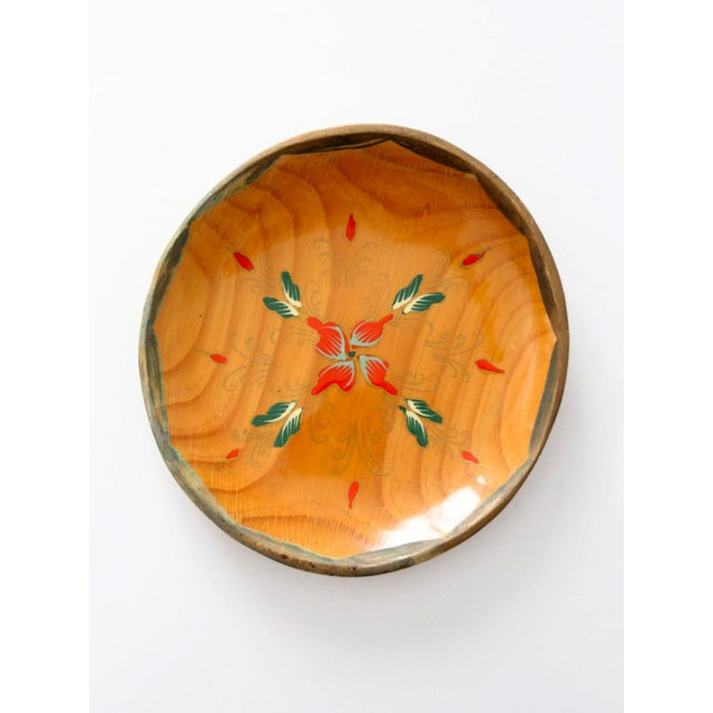 Vintage 1960s hand-painted wooden folk art bowl featuring a carved shallow form with a scalloped edge, natural wood grain,...