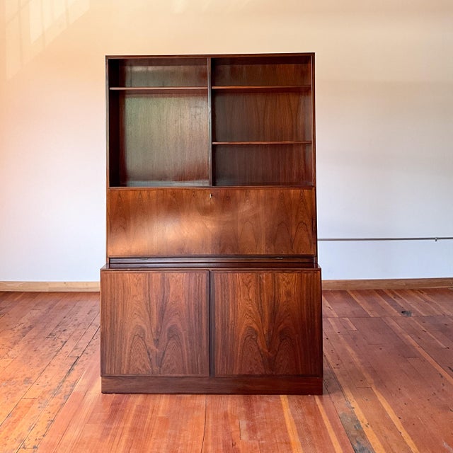 This is en elegant piece for your mid century office or living area. This piece has all the storage you could ask for....