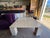 Italian Modern Travertine Cocktail Table. Offered is a stunning cream colored Italian Parsons style square travertine...