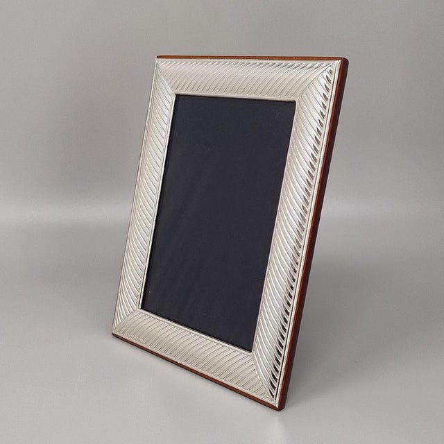 1960s Gorgeous photo frame in silver plated with glass. Made in Italy. The item is in excellent condition . Photo size is...
